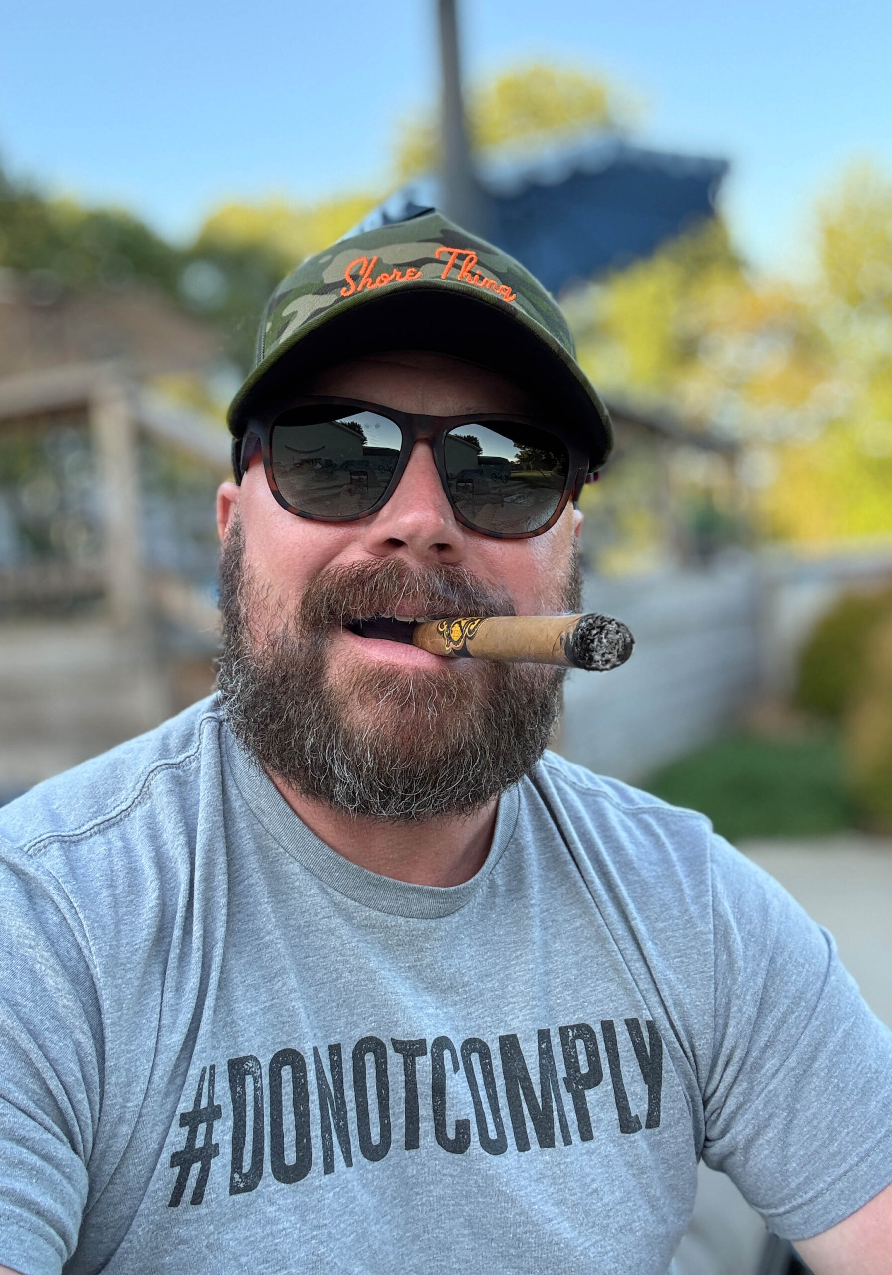 joshua crain smoking a cigar on the range